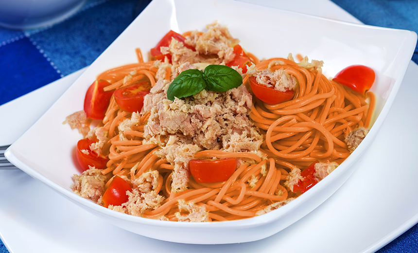 A picture of sweet potato noodles with chunks of tuna and tomato