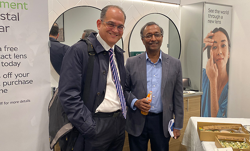 Dr Uday Bhatt and Dr Raj Pathmaraj stand together in the Specsavers Knox City store, smiling at the camera.