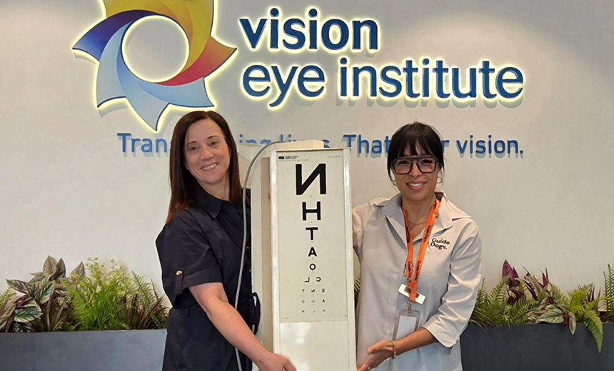 Vision Eye Institute Footscray's practice manager, Therese Malkoun, with Guide Dogs Victoria orthoptist, Khoa Nguyen, holding the Snellen box our Footscray clinic donated to Guide Dogs Victoria.