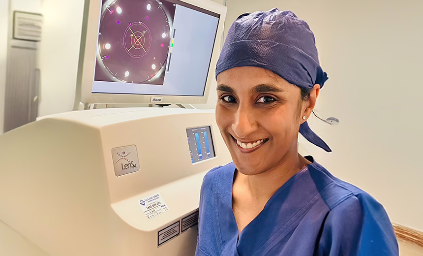 Dr Rushmia Karim in the operating theatre with the LENSx laser which she uses to perform cataract surgery.