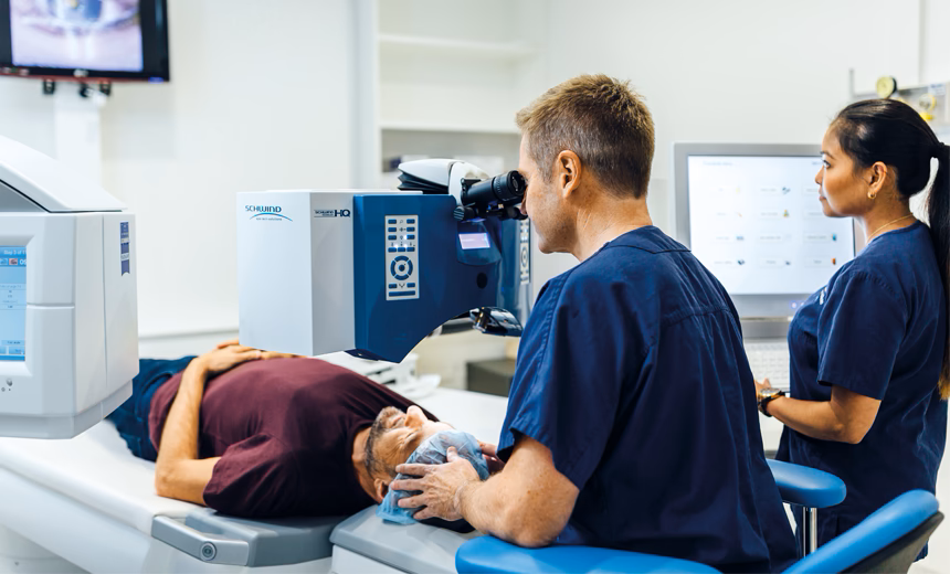Professor Gerard Sutton performing laser eye surgery on a patient.
