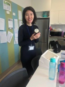 Dr Kyoko Shirato holding a cupcake in celebration of Windsor Gardens Day Surgery's first birthday