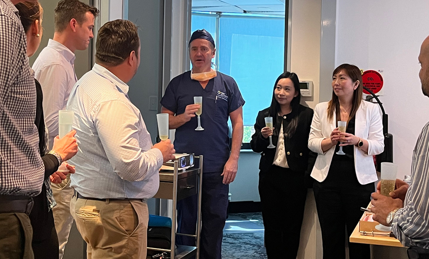 Prof Gerard Sutton and Vision Eye Institute staff share a champagne toast at SMILE laser eye surgery's 10th birthday party.