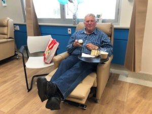 Patient Kevin Solly celebrating Windsor Gardens Day Surgery's first birthday