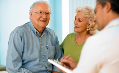 An older couple meeting with a doctor