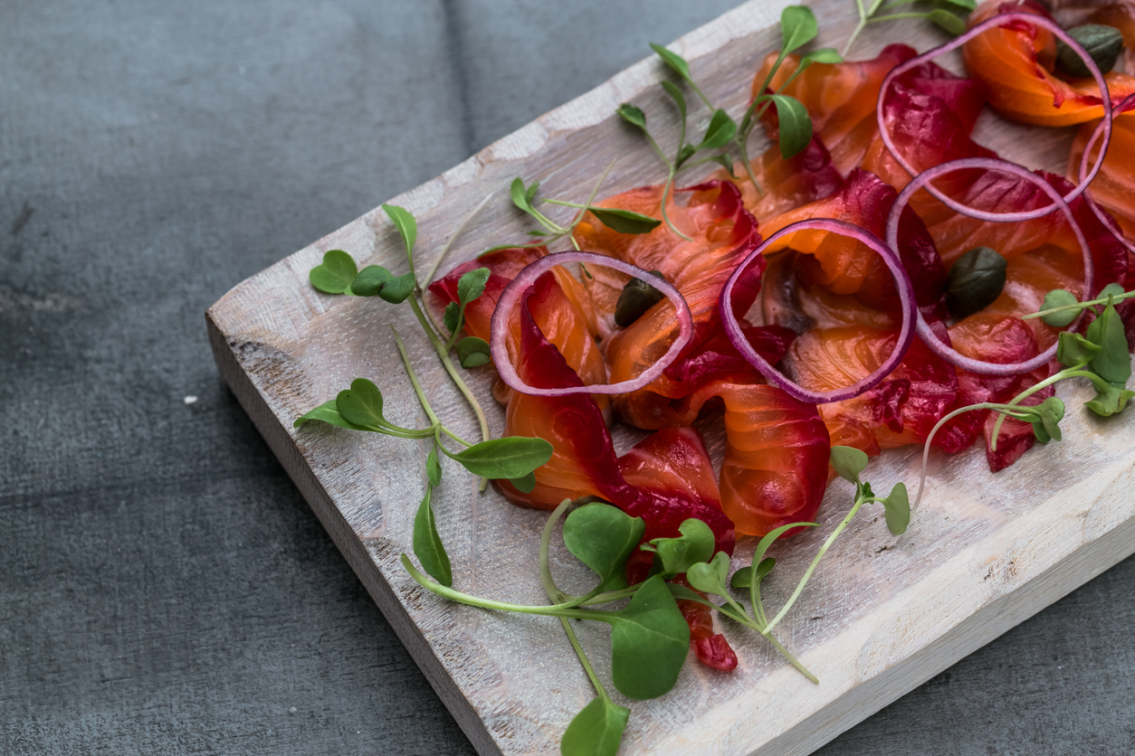 Beetroot cured salmon with cucumber and apple salad