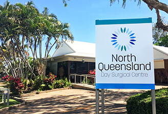 North Queensland day surgical centre exterior image (front of building with signage, driveway and trees)