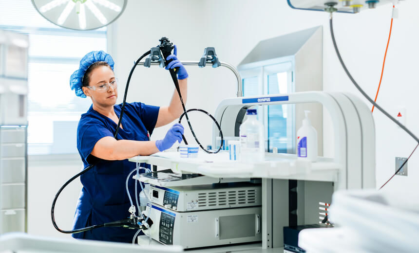 Day surgery nurse holding an endoscope